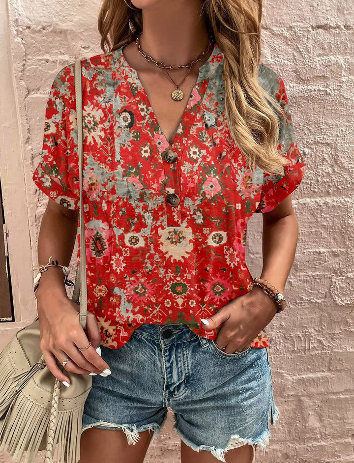 Damebluse med blomsterdesign og knaplukning Stilla