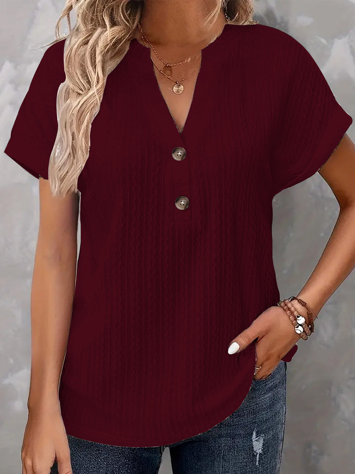 Damebluse med knapdetaljer og struktureret design Stilla