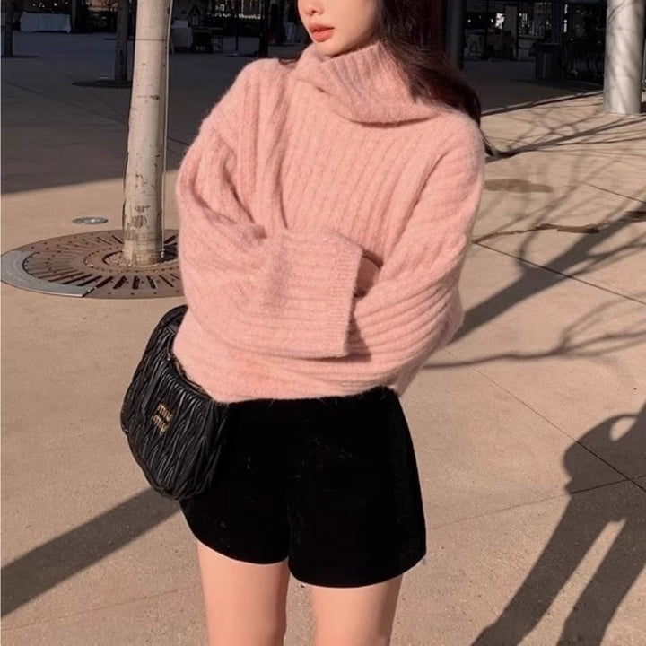 Damers fashionable rullehals sweater med ribstrikket struktur og løs pasform Stilla