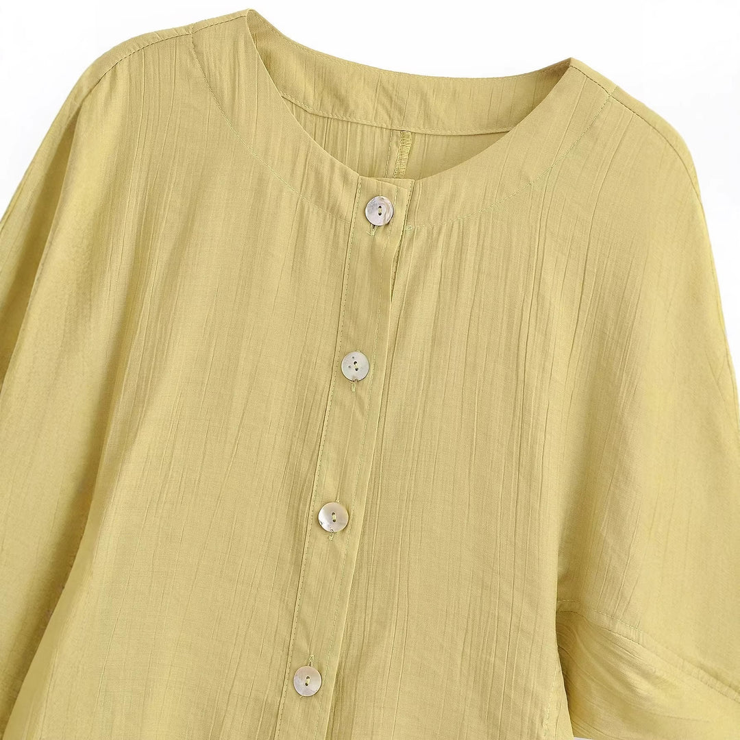 Damebluse med puffærmer og dekorative knapper Skovae