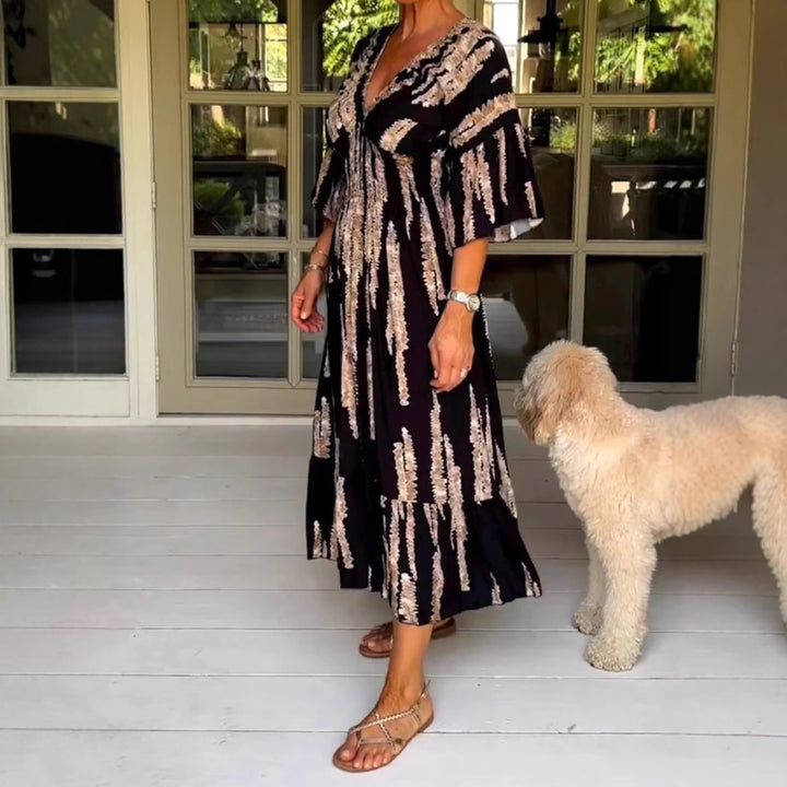 Dame Maxikjole med elegant V-udskæring og flydende skirt Stilla