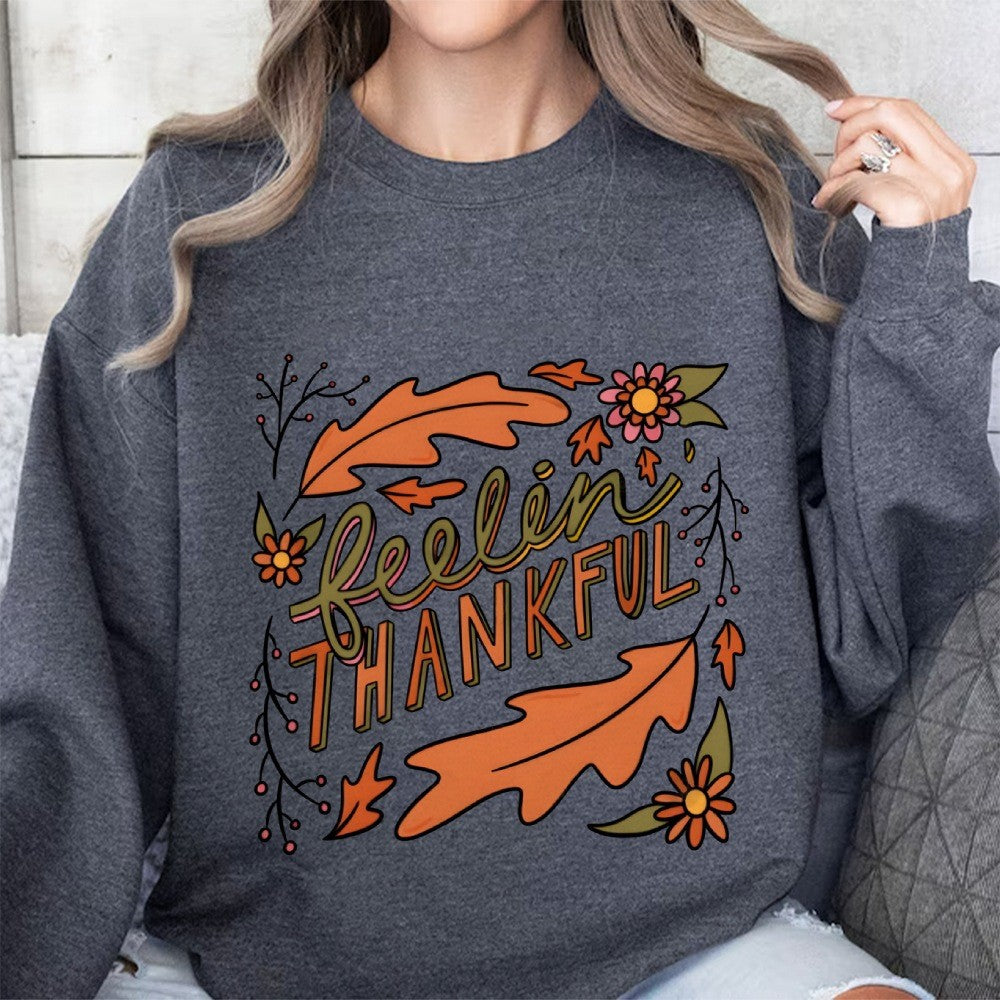 Kvinders sweatshirt med farverigt efterårsdesign og inspirerende tekst Stilla