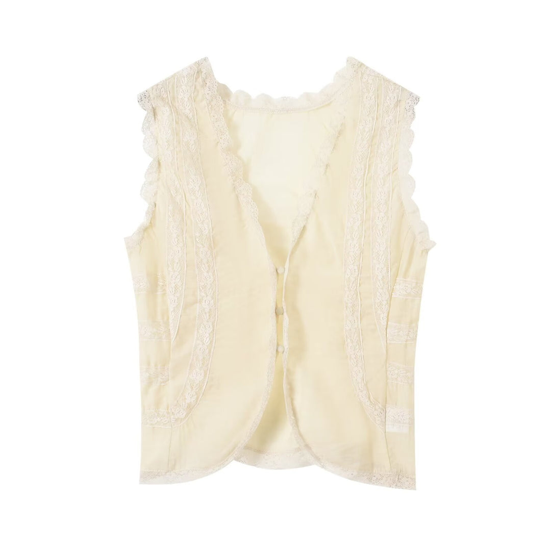 Dame-spidsen top med elegante ruffledetaljer og knaplukninger Skovae