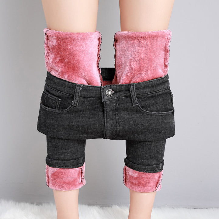 Damerne med højt skårne rørjeans med formende strækbånd og smal ankelafslutning Skovae