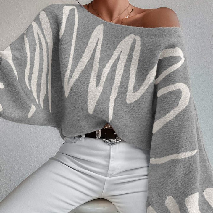 Kvinders oversized striktrøje med asymmetrisk design og afslappet halsudskæring Stilla