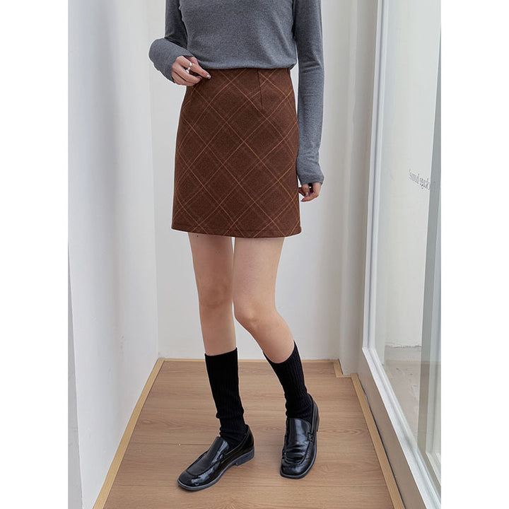 Dame rutet mini skirt i blød uldblanding med elegante lommer og plisseringer Stilla