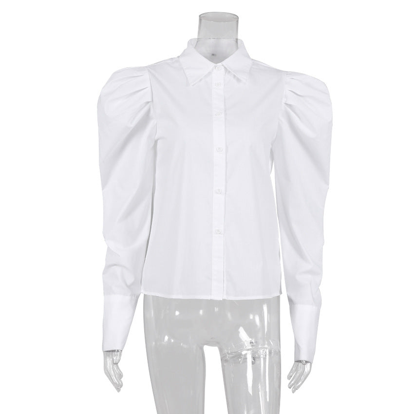 Damebluse med voluminøse puffærmer og elegant ståkrave Stilla