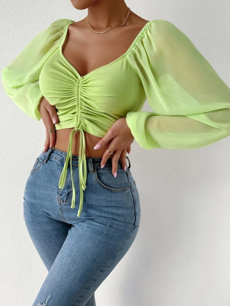 Dame Crop-Top med struktureret krop og elegante pufærmer Skovae