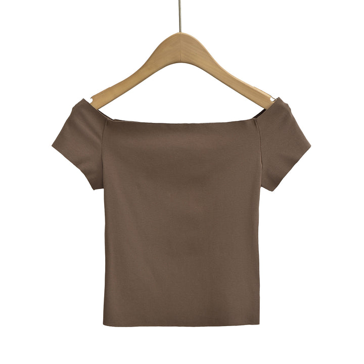 Dame top med smart off-shoulder-design og delikate puffærmer Stilla