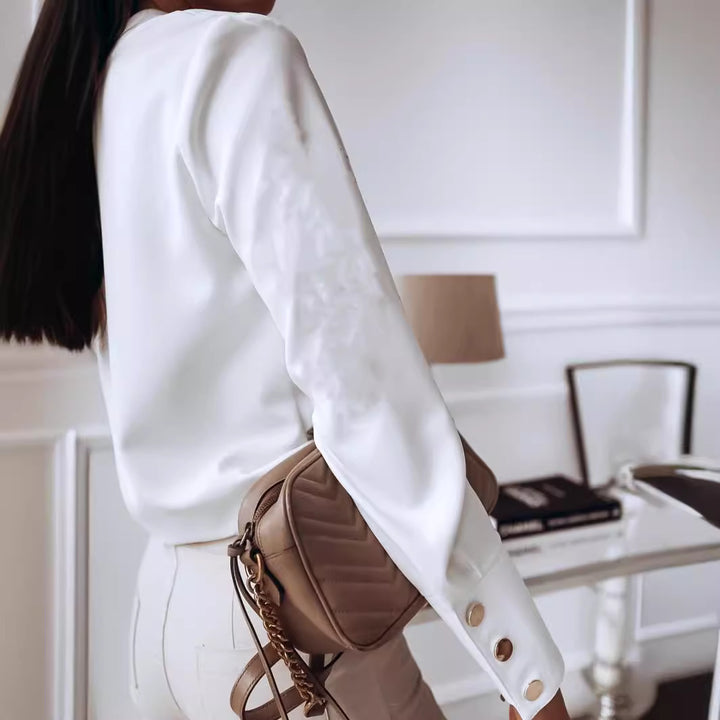 Damers elegante bluse med moderne trykknapper og afslappet pasform Stilla