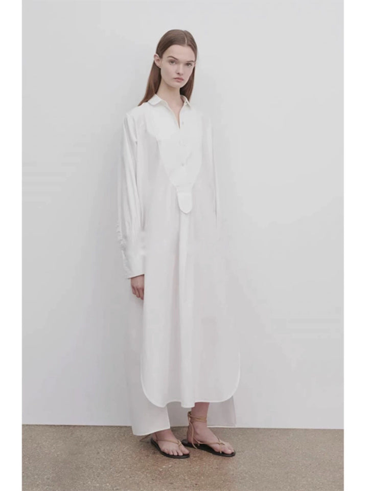 Dame langærmet skjorte med elegant knaplås og asymmetrisk kant Stilla