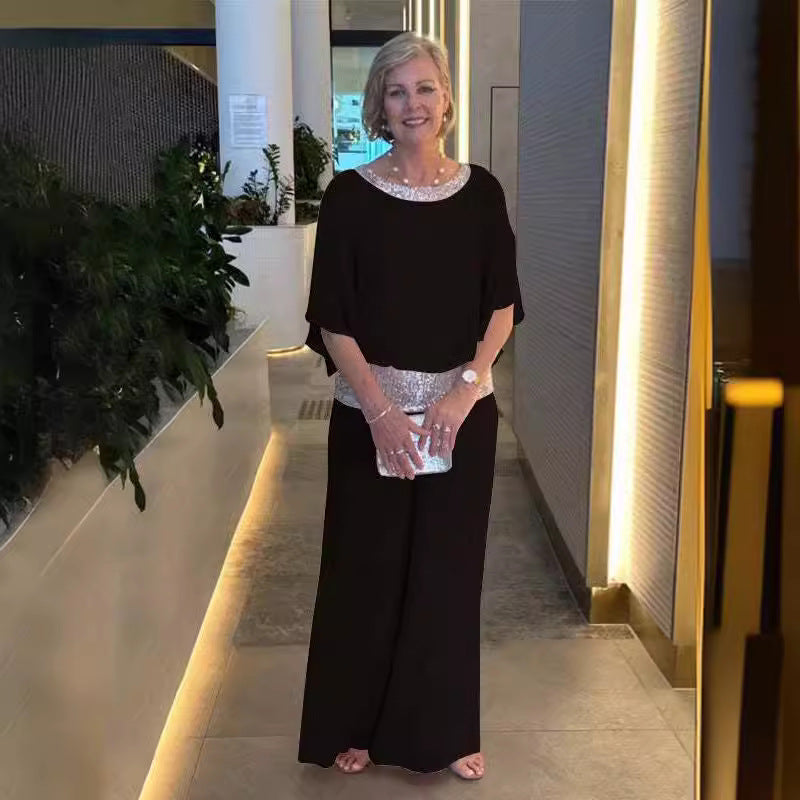 Dame elegant jumpsuit med flydende overdel og glitrende taljebånd Stiila