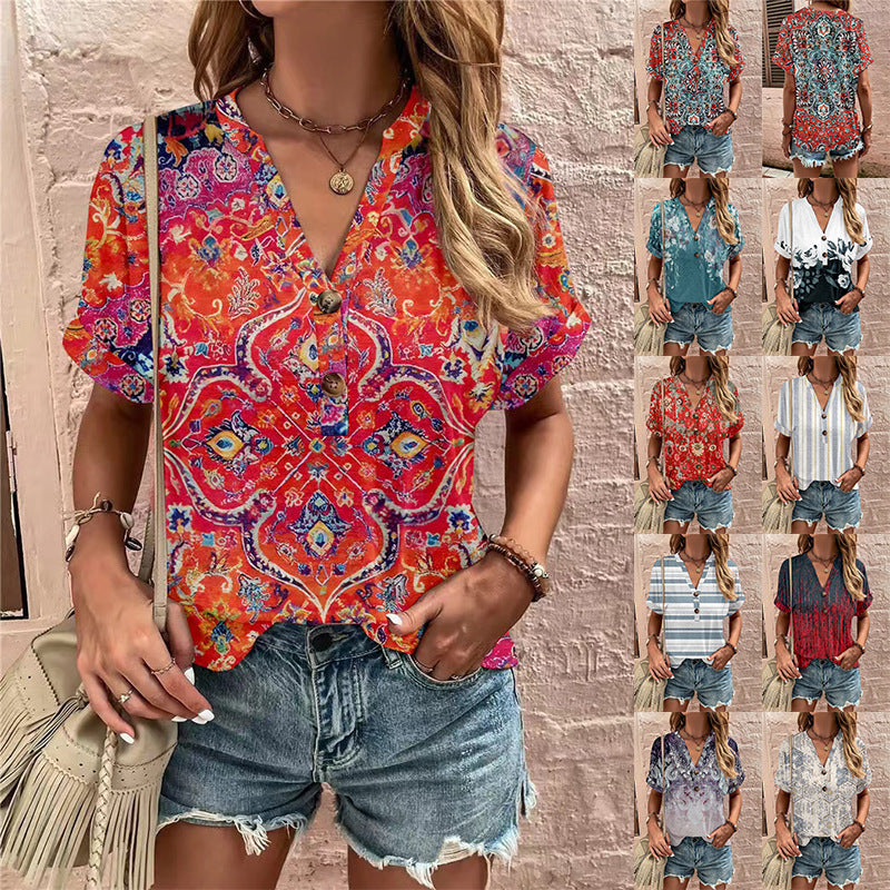 Damebluse med blomsterdesign og knaplukning Stilla