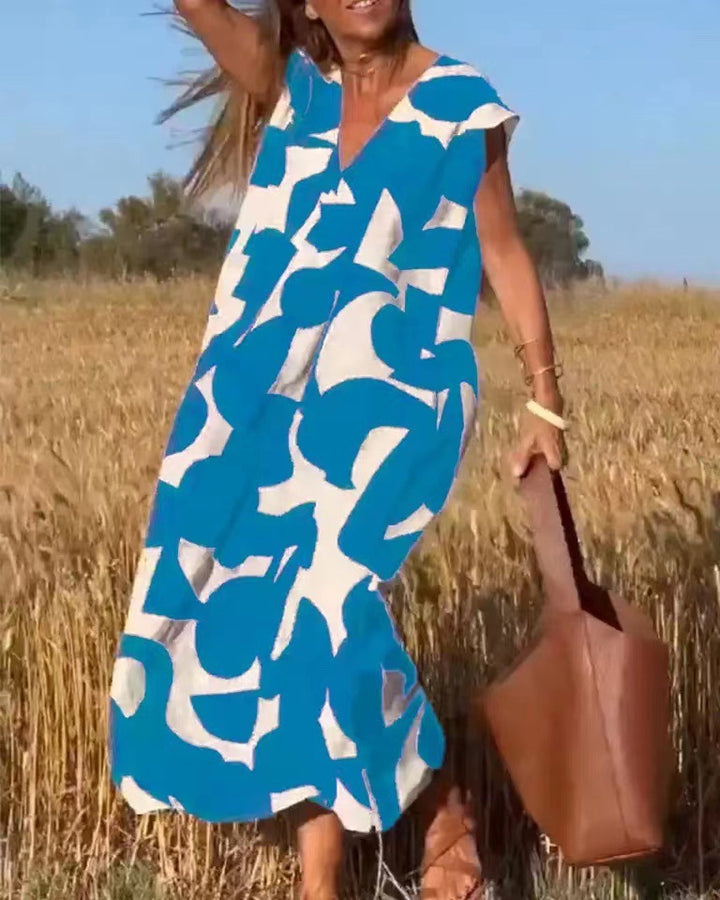 Dame Maxikjole med unikt geometrisk print og elegant V-udskæring Stilla