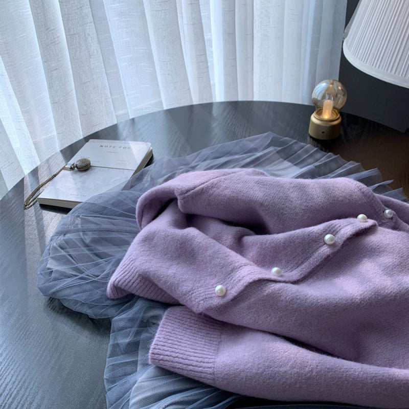 Kvinders cardigan med elegante perleknapper og moderne design Stilla
