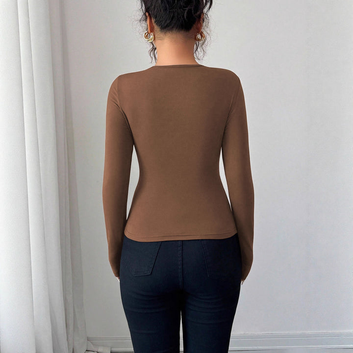 Kvinders bodysuit med dekorativt binding detail og trendy rund halsudskæring Stilla