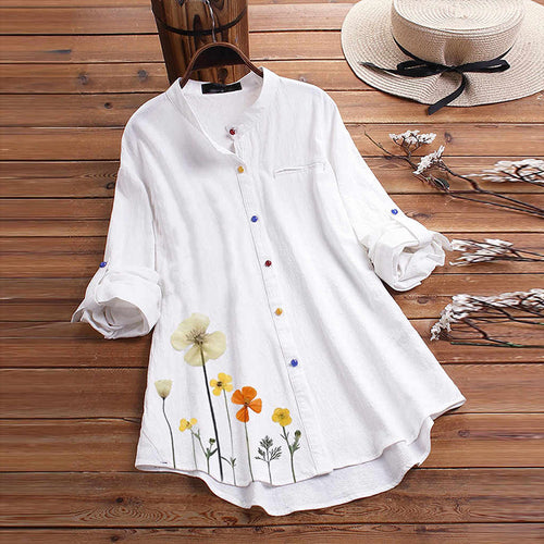 Damebluse med floral design og farverige knapper Stilla