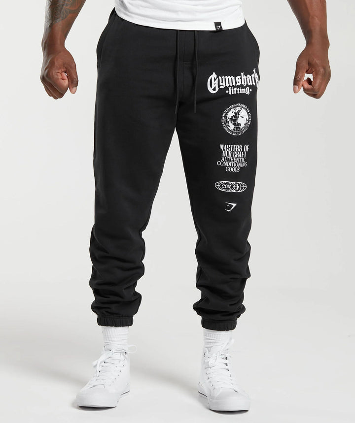 Herre nan konisk skåret bomuldsfleece-sweatpants med elastisk snoretræk ribbede benafslutninger og stort logotryk Skovae