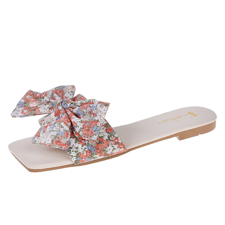 Dame slippers med stort, floralt sløjfe-design og behagelig sål Stilla