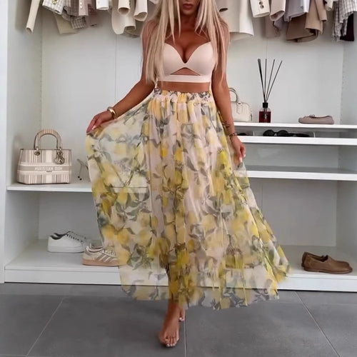 Dame med flydende Maxi-nederdel med flerlagd chiffon-overlag, elastisk talje og fint blomsterprint Skovae