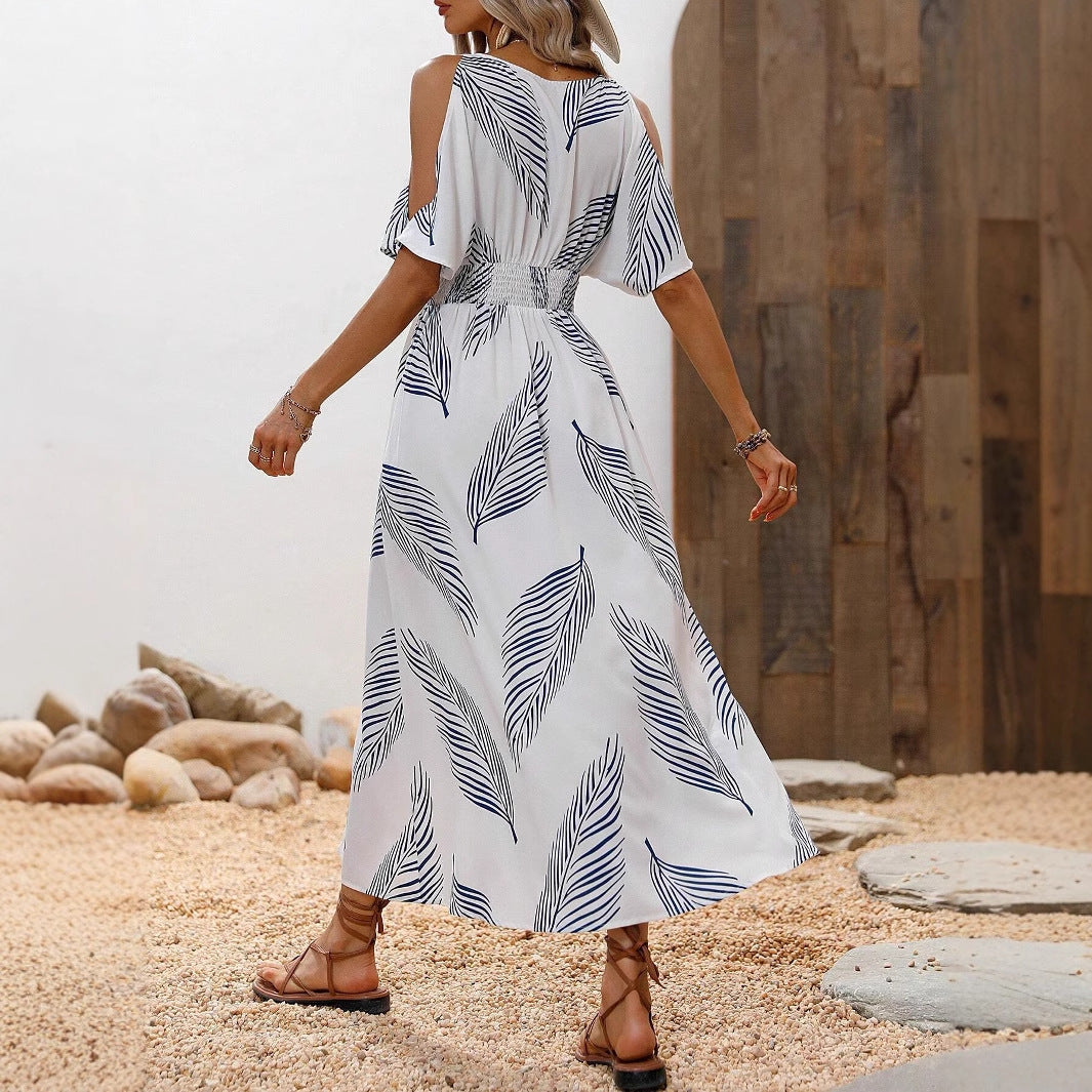 Dame maxikjole med elegant cut-out-design og flydende kant Stilla