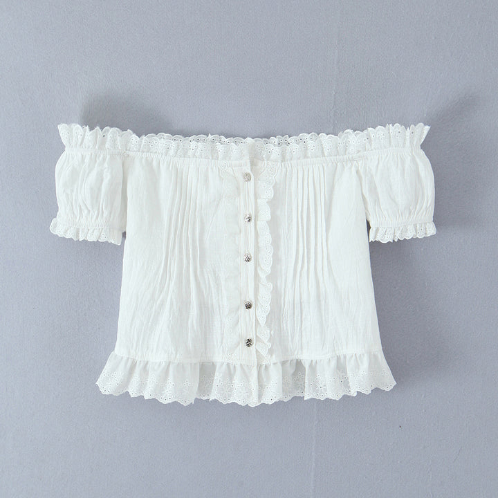 Damer rynket bluse med off-shoulder design og dekorative knapdetaljer Stilla