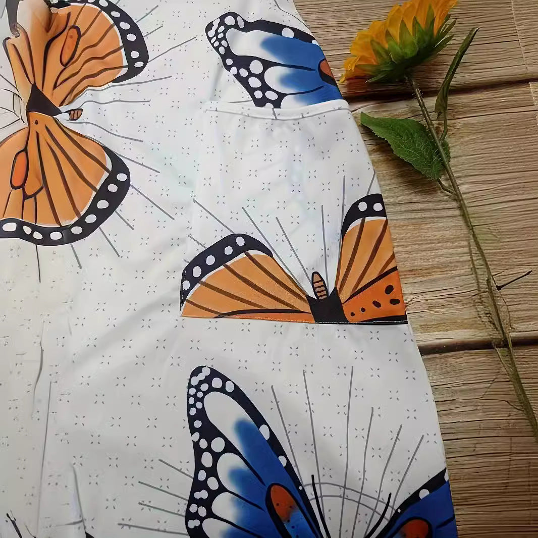Dame jumpsuit med iøjnefaldende sommerfugledesign og praktiske lommer Stilla