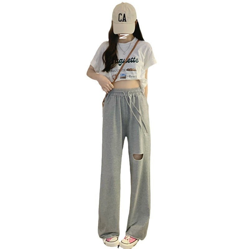 Kvinders casual brede sweatpants med fashionable udskæring og elastisk talje.