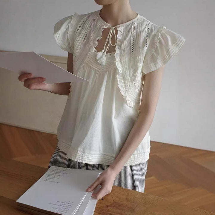 Damebluse med voluminøse ærmer og fine broderidetaljer Stilla