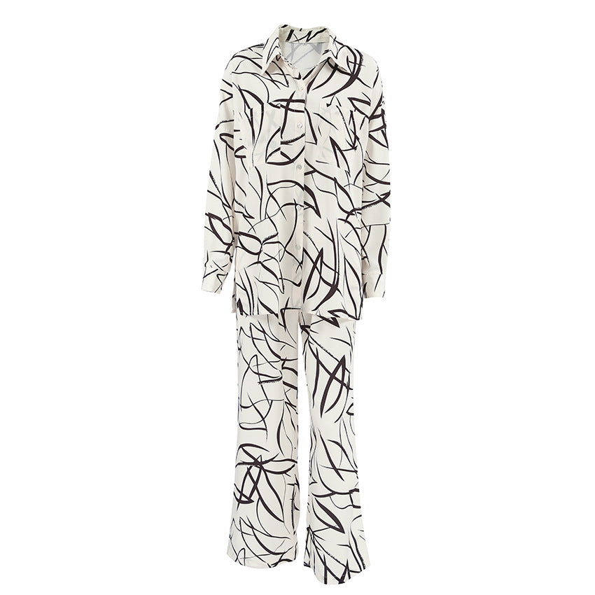 Dame Satin Pyjamasæt med moderne grafiktryk og elegant snit Stilla