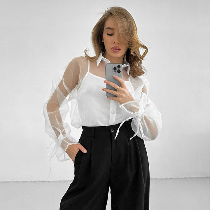 Dame chiffonbluse med gennemsigtige ærmer og elegant knaplukning Stilla