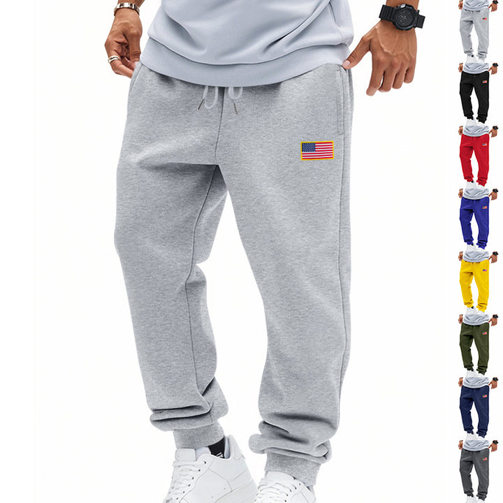 Herrer nan slank sweatpants med konisk hængende ben, elastisk tunneltræk og diskret flagapplikation Skovae
