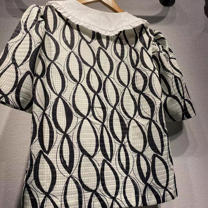 Dame kortærmet bluse med voluminøs krave og attraktivt mønster Stilla