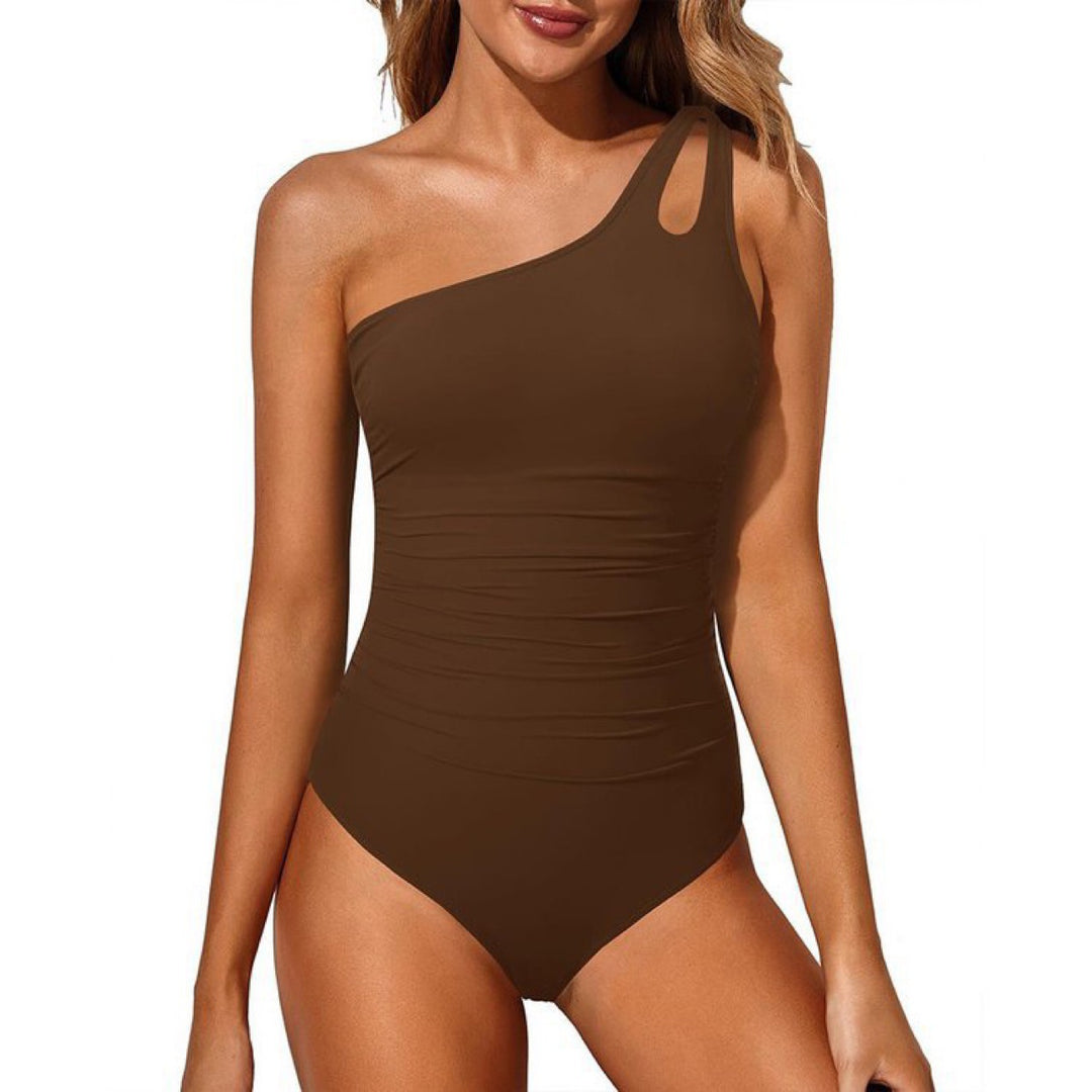 Dame étår badebadedragt med asymmetrisk cut-out-design Skovae