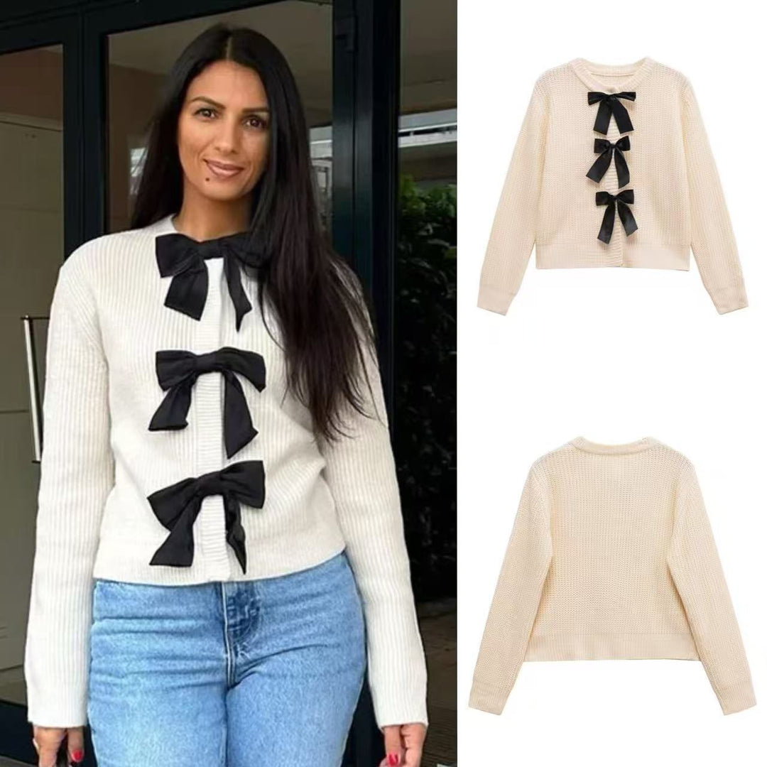 Dame striktrøje med elegante satin-sløjfedetaljer Stilla