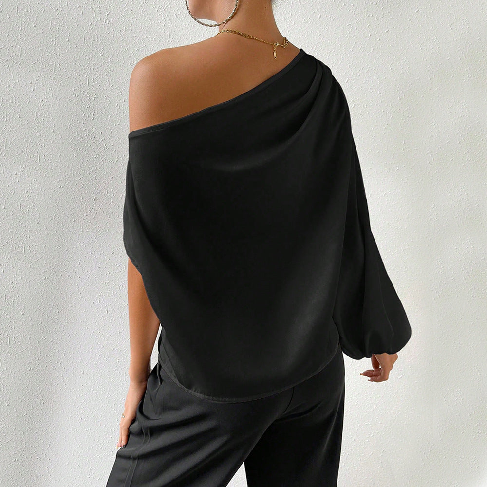 Kvindernes asymmetriske top med elegante puffærmer Stilla