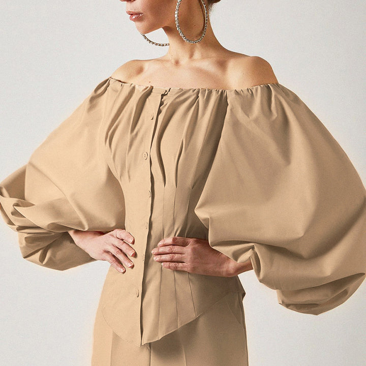 Damebluse med off-shoulder design og voluminøse pufærmer Stilla