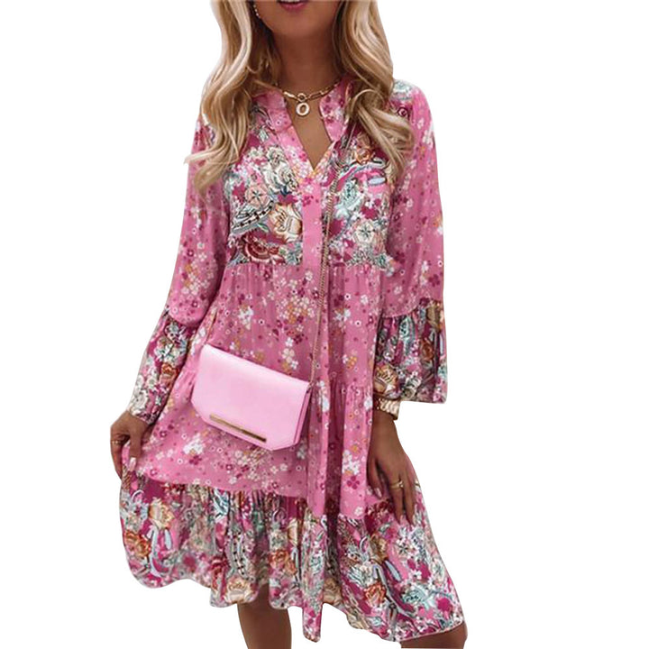 Dame fritidskjole i floral look med moderne V-udskæring og voluminøse ærmer Stilla