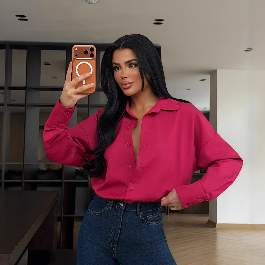 Damer elegant bluse med oversized snit og knapbar design Skovae