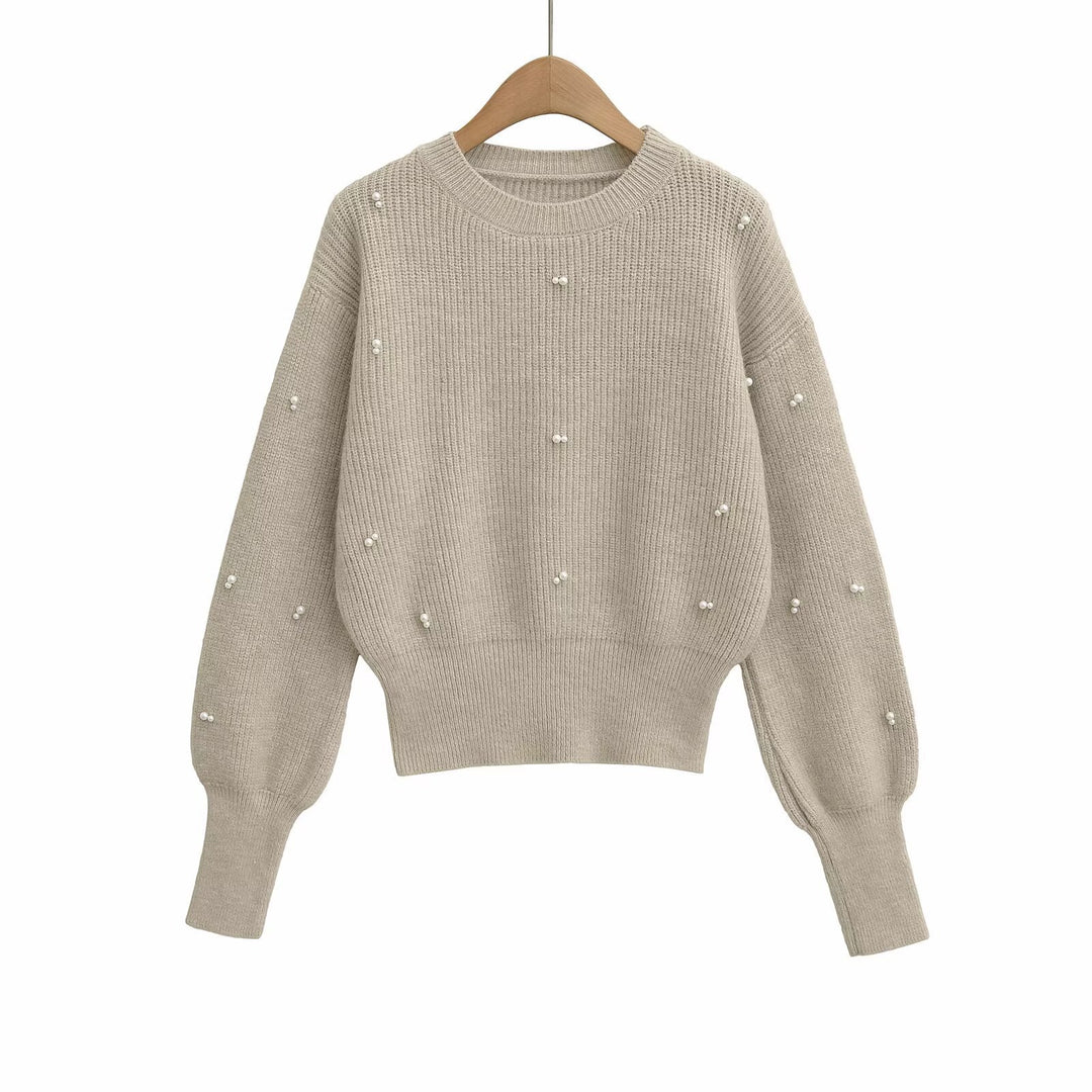 Dame modisk strikpullover med elegante perledetaljer Stilla