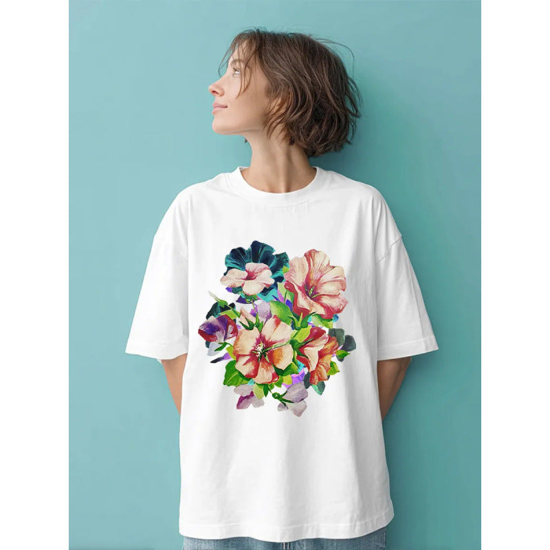 Dame T-shirt med livligt floraldesign og oversized snit Stilla