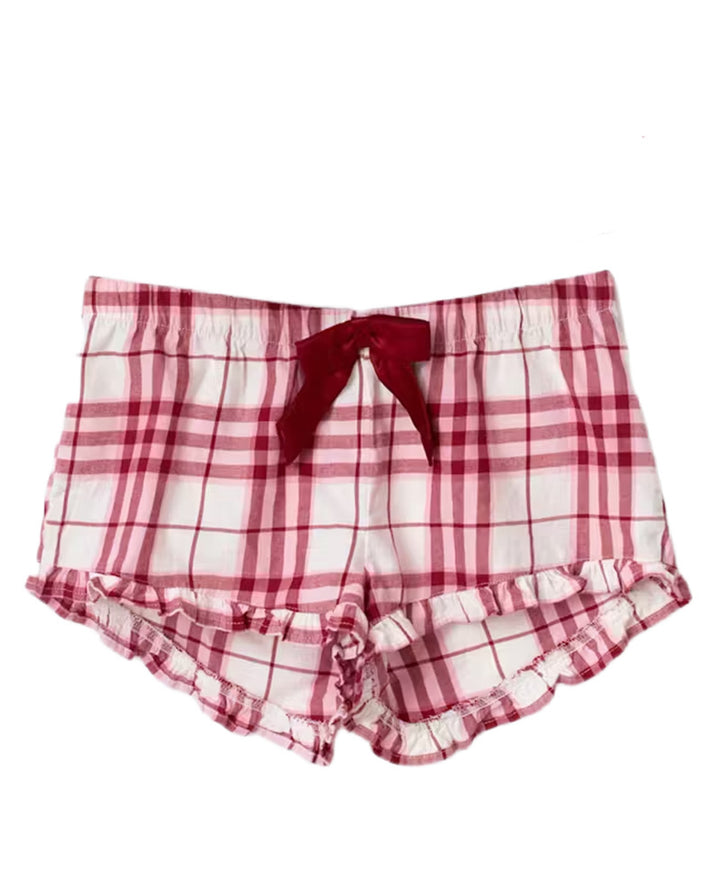 Dame i et afslappet pyjamassæt med rummelig camisole-top, rynket under brystet og bukser med gummibånd Skovae