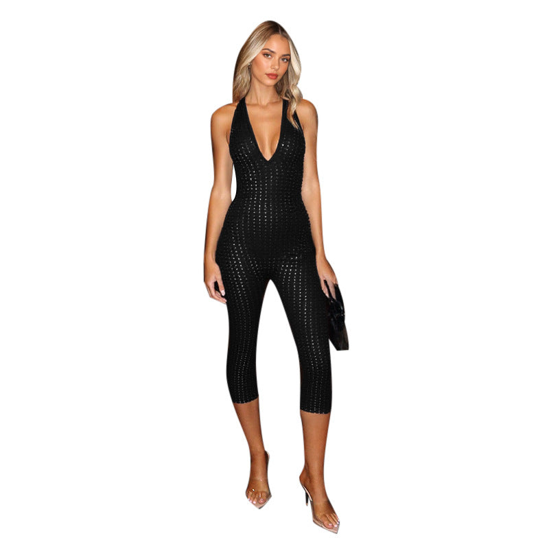 Dame figursyet jumpsuit med dybt V-udskæring og netlignende design Skovae