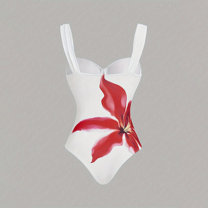 Dame one-piece badedragt med elegant blomsterapplikation og draperet skørt Skovae