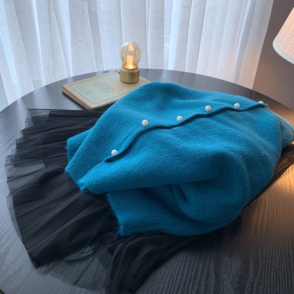 Kvinders cardigan med elegante perleknapper og moderne design Stilla