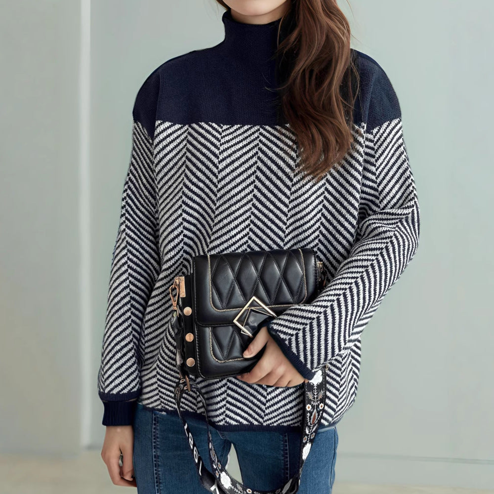 Kvinders hyggelige rullekrave sweater med moderne herringbone mønster og elastiske manchetter Stilla