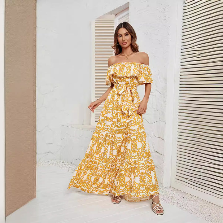 Dame Maxikjole med off-shoulder design og voluminøs flæsekant Stilla
