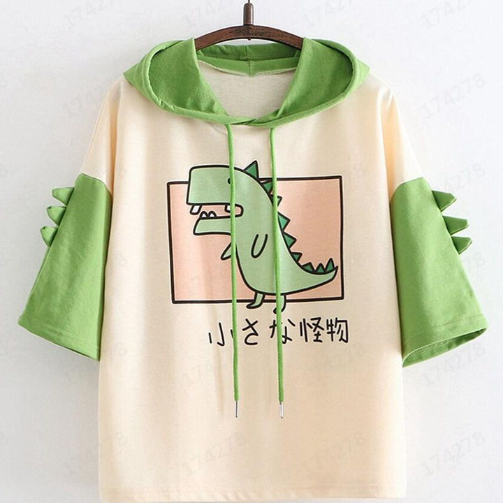 Dame Hoodie-T-shirt med spændende dino-design og stilige 3D-rugfløjter Stilla