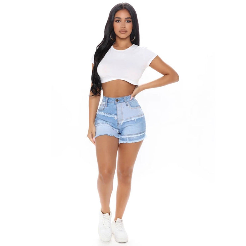 Dame Jeans-Shorts i kreativ patchwork-design med frynset kanter Stilla
