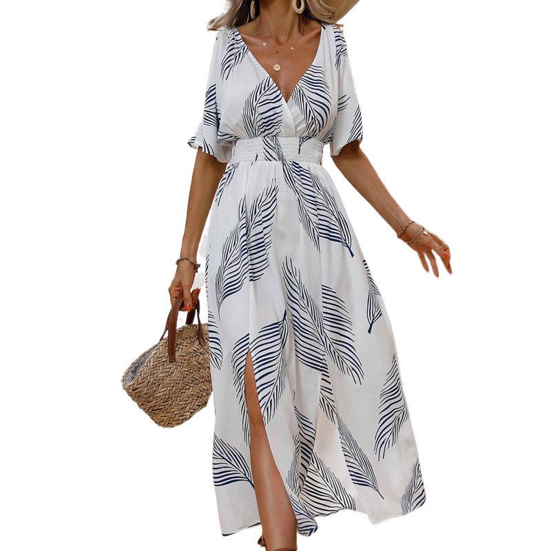 Dame maxikjole med elegant cut-out-design og flydende kant Stilla